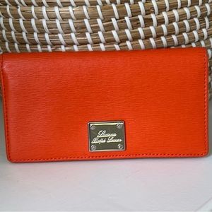 Ralph Lauren leather wallet with outside zippered pouch. Excellent condition!